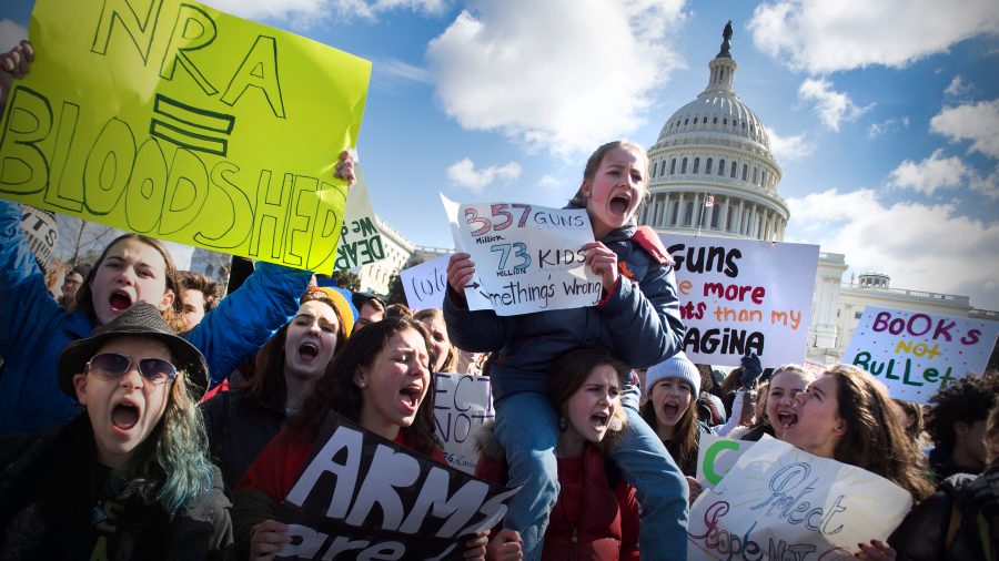 Students participate in a rally with other students from DC, Maryland and Virginia in their Solidarity Walk-Out to urge Republican leaders in Congress