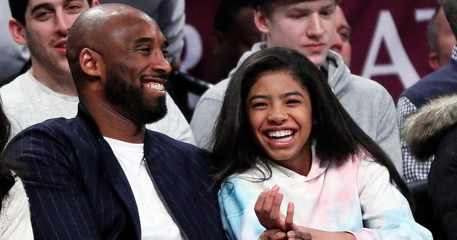 NEW YORK, NY - DECEMBER 21:  Retired NBA star Kobe Bryant and his daughter Gigi, watch an NBA basketball game between the Brooklyn Nets and Atlanta Hawks on December 21, 2019 at Barclays Center in the Brooklyn borough of New York City. Nets won 122-112. NOTE TO USER: User expressly acknowledges and agrees that, by downloading and/or using this Photograph, user is consenting to the terms and conditions of the Getty License agreement. Mandatory Copyright Notice (Photo by Paul Bereswill/Getty Images)
