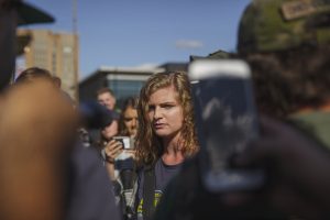 September 29, 2018 - Kent, Ohio, United States - Kaitlin Bennett, a a squad of Three Precenter Milita members and a wall of police, tried to debate counter protesters.Kaitlin Bennett, a former student of Kent State University, lead an open carry protest on her former campus. The Three Precenters came in as bodyguards for Bennett and her group Liberty Hangout.  On September 29, 2018 in Kent, Ohio, USA. (Credit Image: © Shay Horse/NurPhoto/ZUMA Press)