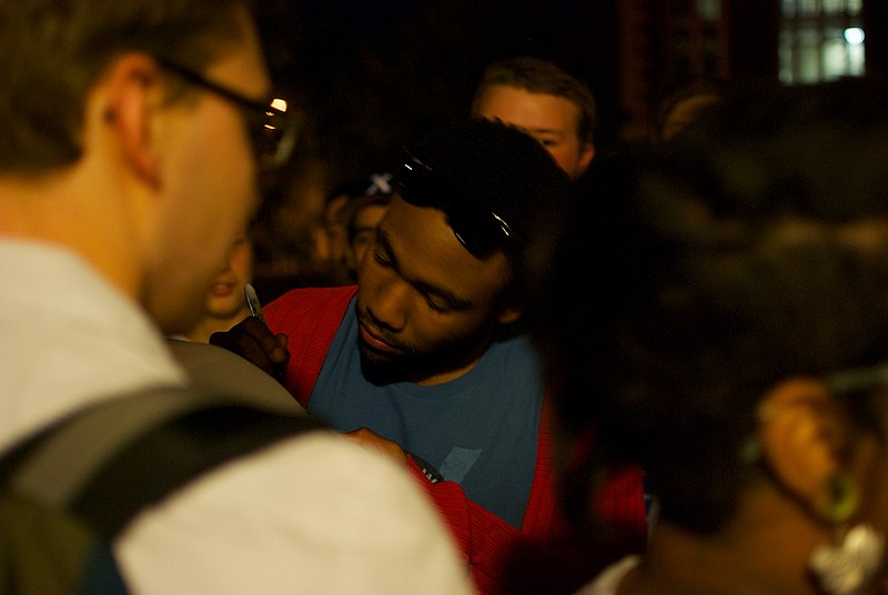 Donald Glover signing autographs 
Jermiah, CC BY 2.0, via Wikimedia Commons