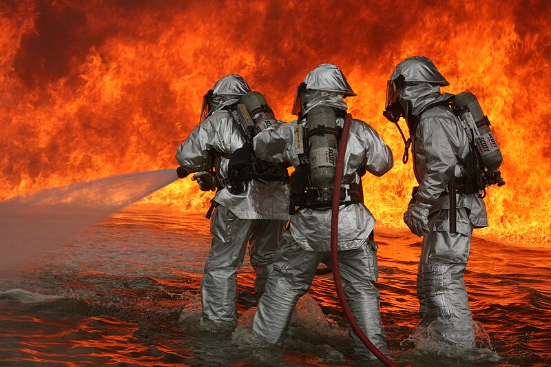 Aircraft, Rescue Firfighters aboard Marine Corps Air Station Miramar fight blazing fires during a controlled burn at the burn pit here. ARFF performed controlled burns June 13-14, they perform these burns about four times a year.